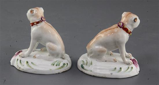 A pair of Derby figures of pug dogs, c.1760-5, h. 7cm, tails lacking